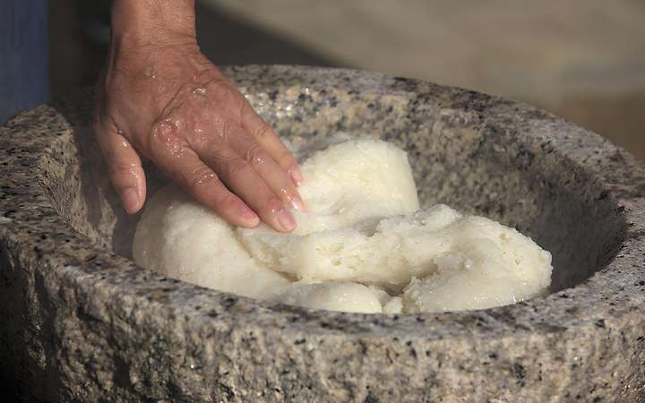 Traditional Mochitsuki rice pounding ceremony in Japan – cultural event showcasing Japanese New Year customs, teamwork, and mochi-making using wooden mallets and usu mortar