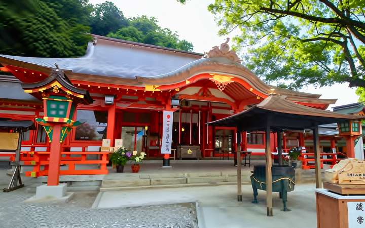 Nachi Grand Shrine in Wakayama, Japan, surrounded by lush forest and overlooking Nachi Falls — a sacred site on the Kumano Kodo pilgrimage route, blending Shinto tradition and natural beauty.