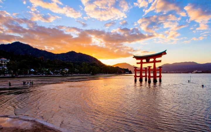 Iconic floating torii gate of Itsukushima Shrine on Miyajima Island, Japan — a UNESCO World Heritage Site known for its dramatic tides and Shinto architecture