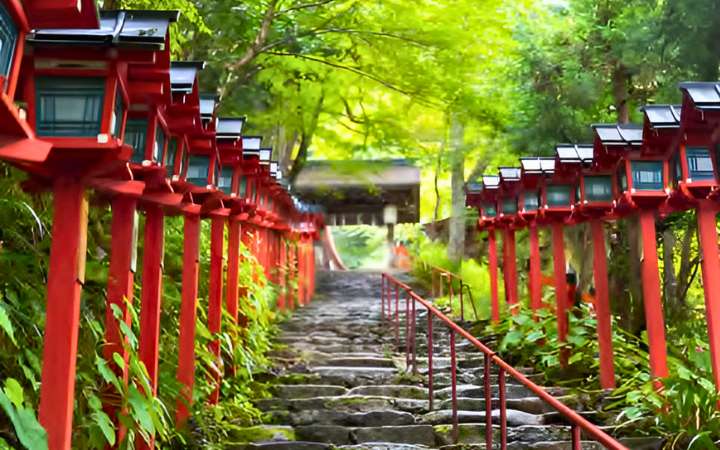 Kifune Shrine in the forested mountains north of Kyoto, Japan – ancient Shinto shrine renowned for its peaceful atmosphere, stone lantern-lined paths, and cool summer air