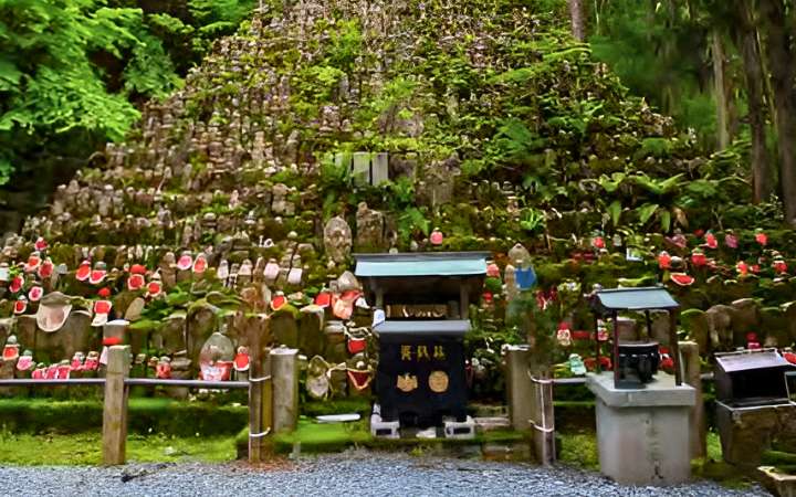 Mystical pathway through Okunoin Cemetery in Koyasan, Japan, lined with moss-covered stone lanterns and ancient tombstones – a sacred site and spiritual destination in Japanese Buddhism.