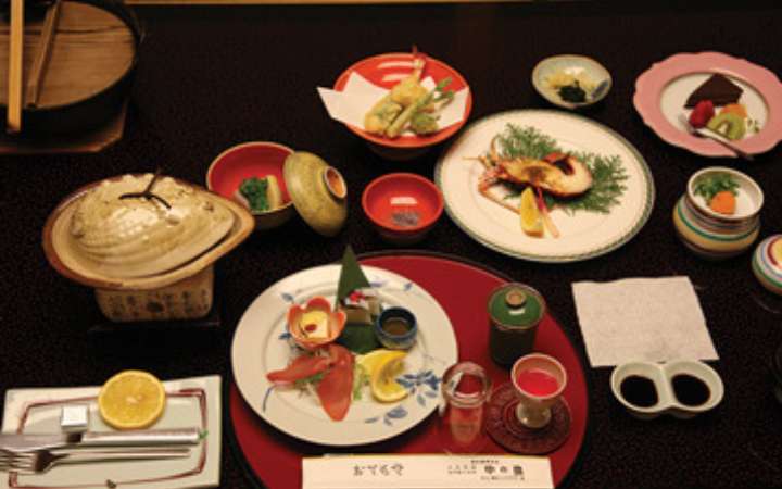 Traditional Japanese kaiseki meal – multi-course dining experience featuring seasonal dishes, fresh seafood, and artistic presentation in a ryokan or fine dining restaurant in Japan