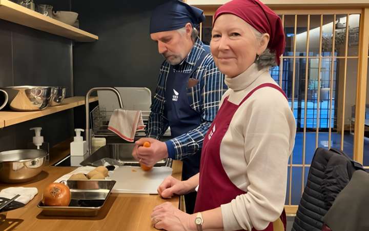 Tourists learning Hida Furukawa cuisine during a traditional Japanese cooking workshop