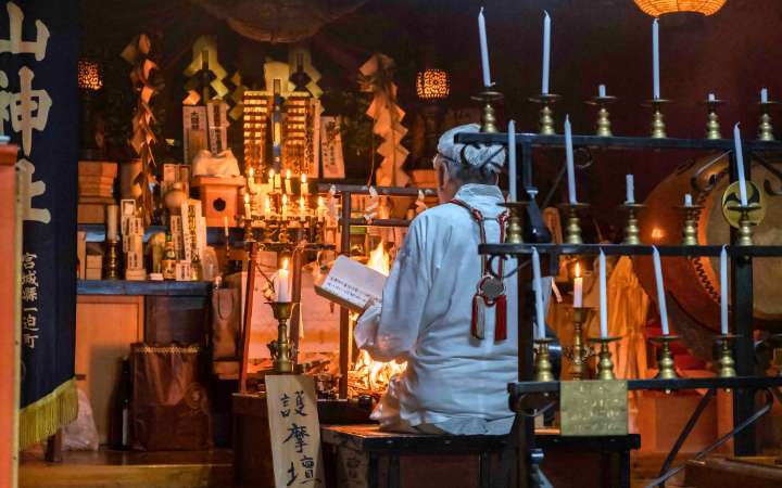 Yamabushi monk performing Shugendō fire ritual on Mount Haguro, Yamagata, Japan, traditional ascetic practice in the Dewa Sanzan sacred mountains