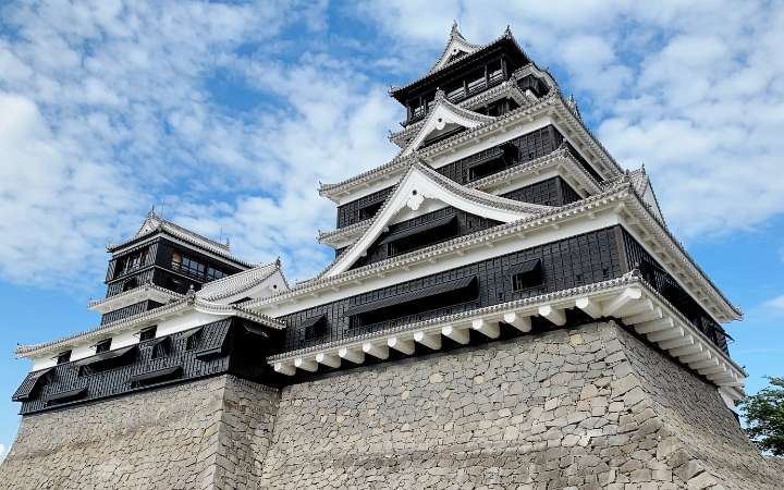 Kumamoto Castle in Japan, a historic samurai castle with black exterior and stone walls in Kyushu