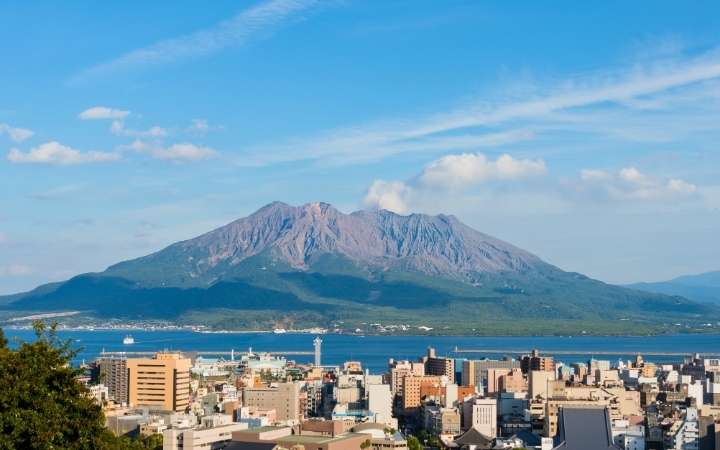 Sakurajima volcano in Kagoshima, Japan, an active volcano with dramatic volcanic landscape and coastal views