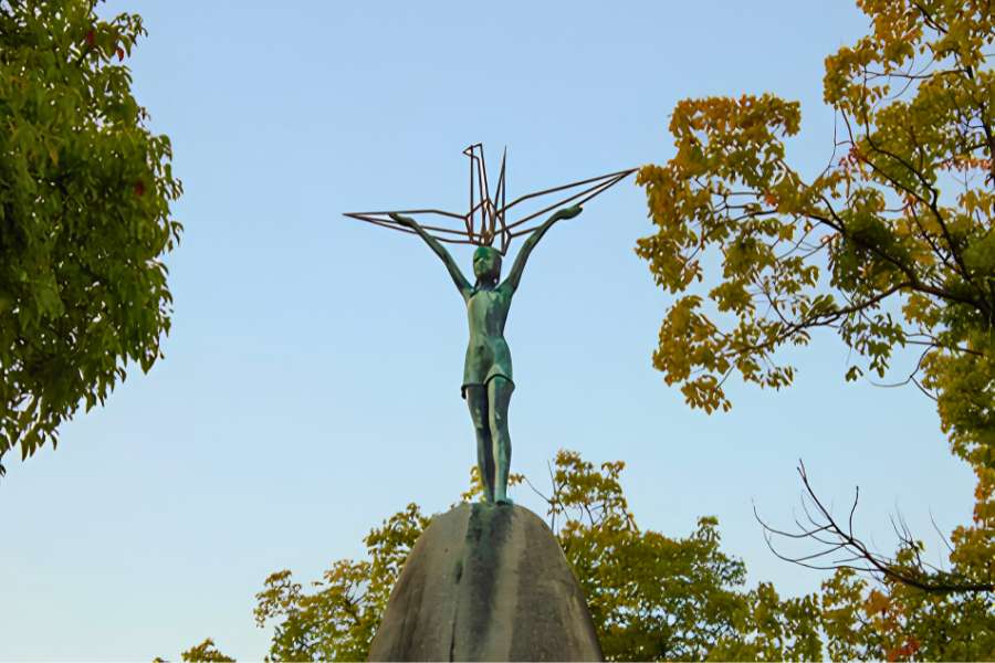 The Children’s Peace Monument in Hiroshima Peace Memorial Park commemorates Sadako Sasaki and all children affected by the 1945 atomic bombing. Thousands of colorful origami cranes are offered here each year as symbols of peace.